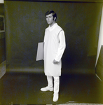 Man in X-Ray Apron Holding Film for Medico Int., K by George Skip Gandy IV