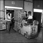 Two Men Working in the Warehouse, A by Skip Gandy