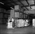 Man Working in Warehouse, B by Skip Gandy