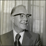 Man in Glasses Smiling, A
