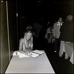 Woman Signing a Book, A by Skip Gandy