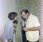 Two Attendees Socialize, Misener Industries by George Skip Gandy IV