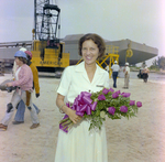 Woman Holding Flowers at Barge Launch, Misener Industries, B by George Skip Gandy IV