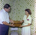 Two People Open Box, Misener Industries by George Skip Gandy IV