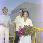 Woman Holding Flowers at Barge Launch, Misener Industries, C by George Skip Gandy IV