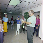 Man Opening Champagne at DC-530 Launch Event, Misener Industries, B by George Skip Gandy IV