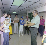 Man Opening Champagne at DC-530 Launch Event, Misener Industries, C by George Skip Gandy IV