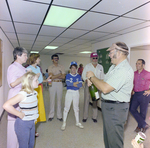 Man Opening Champagne at DC-530 Launch Event, Misener Industries, D by George Skip Gandy IV