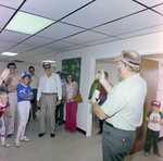 Man Opening Champagne at DC-530 Launch Event, Misener Industries, E by George Skip Gandy IV