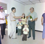 Man Pouring Champagne at DC-530 Launch, Misener Industries, C by George Skip Gandy IV
