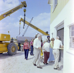 Attendees Near Cranes and Building at Launch Event, Misener Industries, A by George Skip Gandy IV