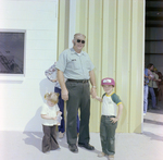 Man and Two Children at Barge Launch Event, Misener Industries by George Skip Gandy IV