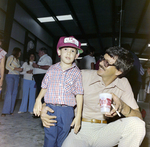 Man and Child at Barge Launch Event, Misener Industries, A by George Skip Gandy IV