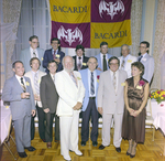 Attendees Under Bacardi Sign at Misener Industries Event, D by George Skip Gandy IV