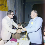Goerlich and Attendee Shake Hands by Head Table at Misener Industries Event, A by George Skip Gandy IV