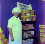 Man Smiling Next to a Display of Sunshine Cookie, Tampa, Florida