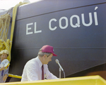 Man Speaks on Platform at El Coqui Launch, Misener Industries by George Skip Gandy IV