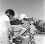 Doug and Unknown Employee Spraying Barge, Misener Industries, A by George Skip Gandy IV