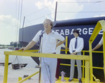 Man Speaks to Audience at Seabarge 251 Launch, Misener Industries, C by George Skip Gandy IV