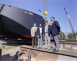 Four Men by G.I. 253 Freight Barge, Misener Industries, A by George Skip Gandy IV