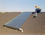 Employee Installing Solar Panel on Roof, A by George Skip Gandy IV
