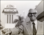 Man Smiling Outside Alamo Rent-A-Car, B by Skip Gandy