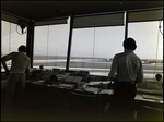 Men in a the Control Center at Piper Bay Air Service by Skip Gandy
