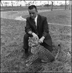 Man With Cheetah Cub at Busch Gardens, A by Skip Gandy