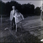 Woman with Shovel at Groundbreaking, A