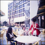 Server with Customers at Outside Patio, Host Hotel