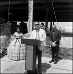 Miss Cypress Gardens and Man at Podium at Groundbreaking for Barnett Bank of Tampa, B by Skip Gandy