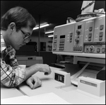 Man Presses Control Buttons, B by Skip Gandy