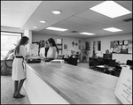 Three Women at Front Desk of Bay Center Corporation by Skip Gandy