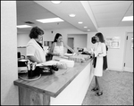 Four Women at Front Desk of Bay Center Corporation by Skip Gandy