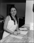 Woman at Front Desk of Bay Center Corporation, C by Skip Gandy