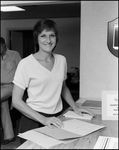 Woman at Front Desk of Bay Center Corporation, D by Skip Gandy