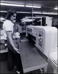 Man Watches Printing Equipment, B by Skip Gandy