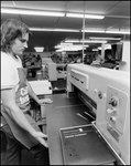 Man Watches Printing Equipment, C by Skip Gandy