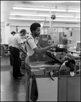 Men Working with Printing Equipment, D by Skip Gandy