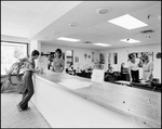People at Front Desk of Bay Center Corporation, B by Skip Gandy