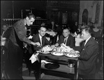 Waiter Serves Lobster Claws at the Columbia Restaurant by Skip Gandy