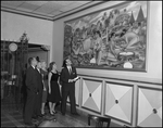 Group Looks at Painting at the Columbia Restaurant