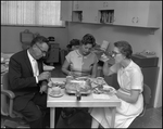 One Man and Two Women Eat in Breakroom, A by Skip Gandy