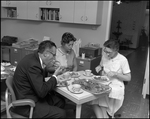 One Man and Two Women Eat in Breakroom, B by Skip Gandy