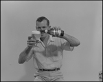 Man Pours Tropical Ale from Bottle into Glass, B by Skip Gandy