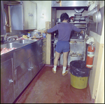 Man Cooks in Commercial Kitchen, B by Skip Gandy