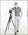 Man Leaning on Canon Camera, B by Skip Gandy