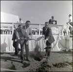 Two Men Shovelling Dirt at Groundbreaking Ceremony by Skip Gandy