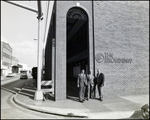 Three Men in Front of the Broadway National Bank, A by Skip Gandy