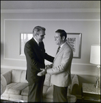 Two Men Shaking Hands in an Office by Skip Gandy